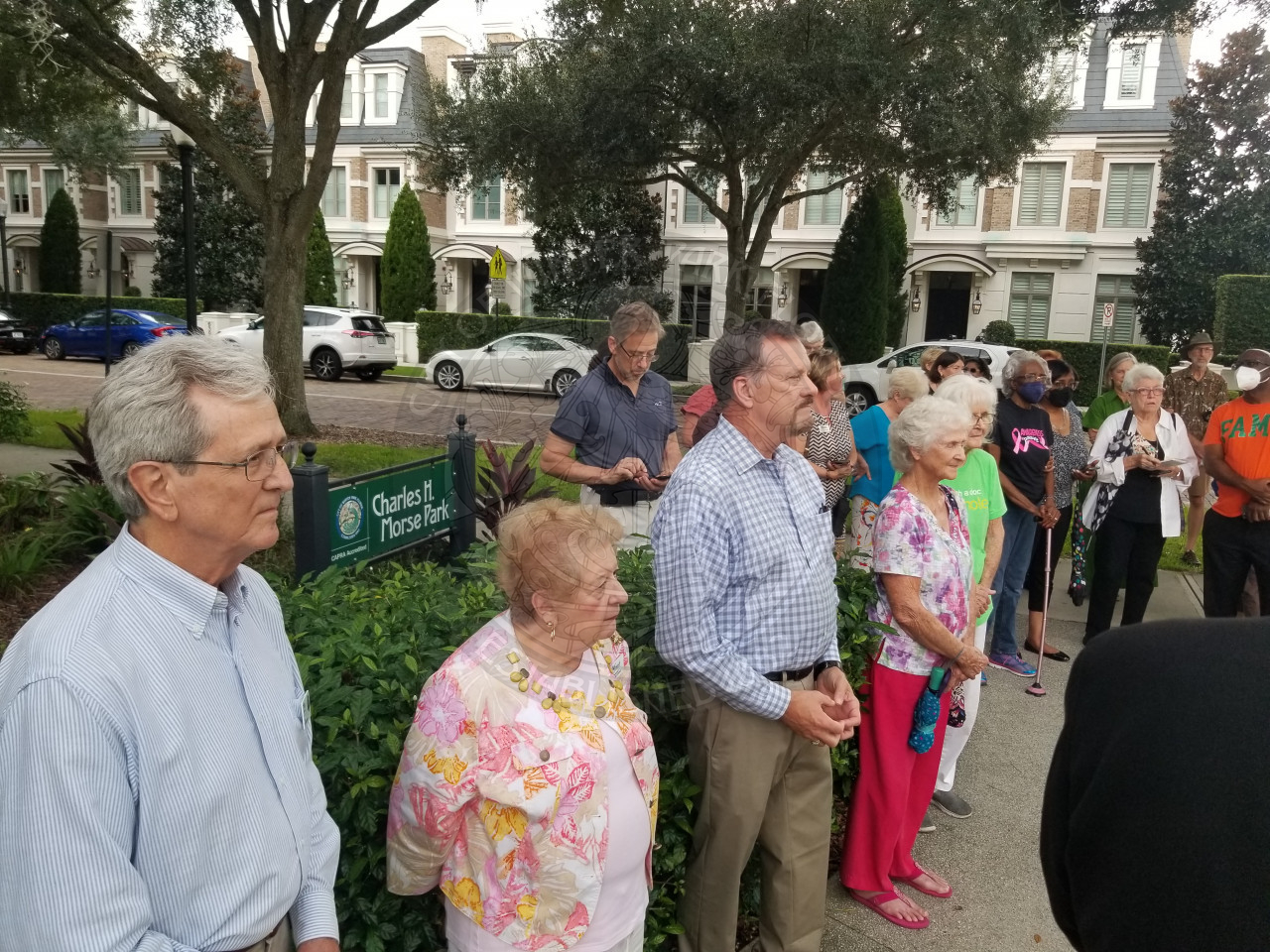 people gathered as they watch the historic marker being unveiled