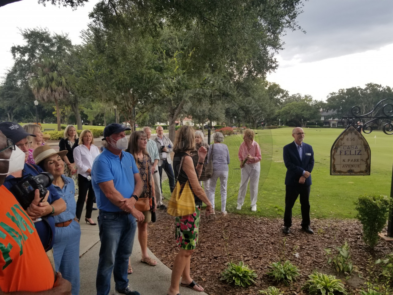 people gathered as they watch the historic sign being unveiled