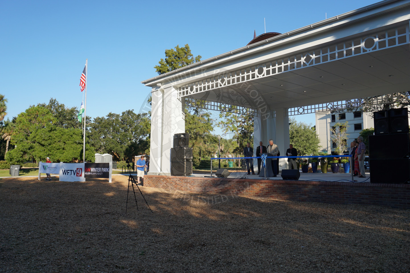 view of the main stage with a flag pol of the left fying the American flag