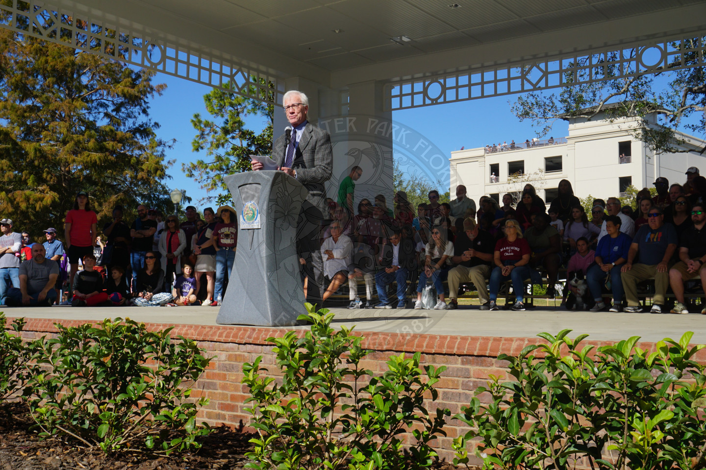 Mayor Anderson speaking before FSU and OU bands battle against each other