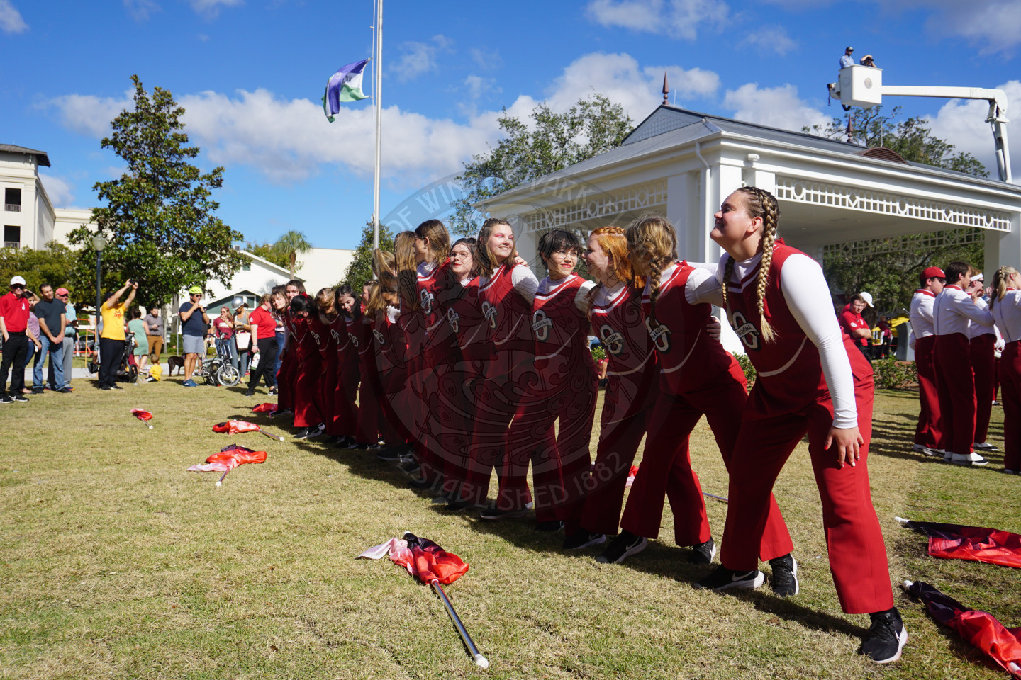 OU colorguard linked in arms to their fight song