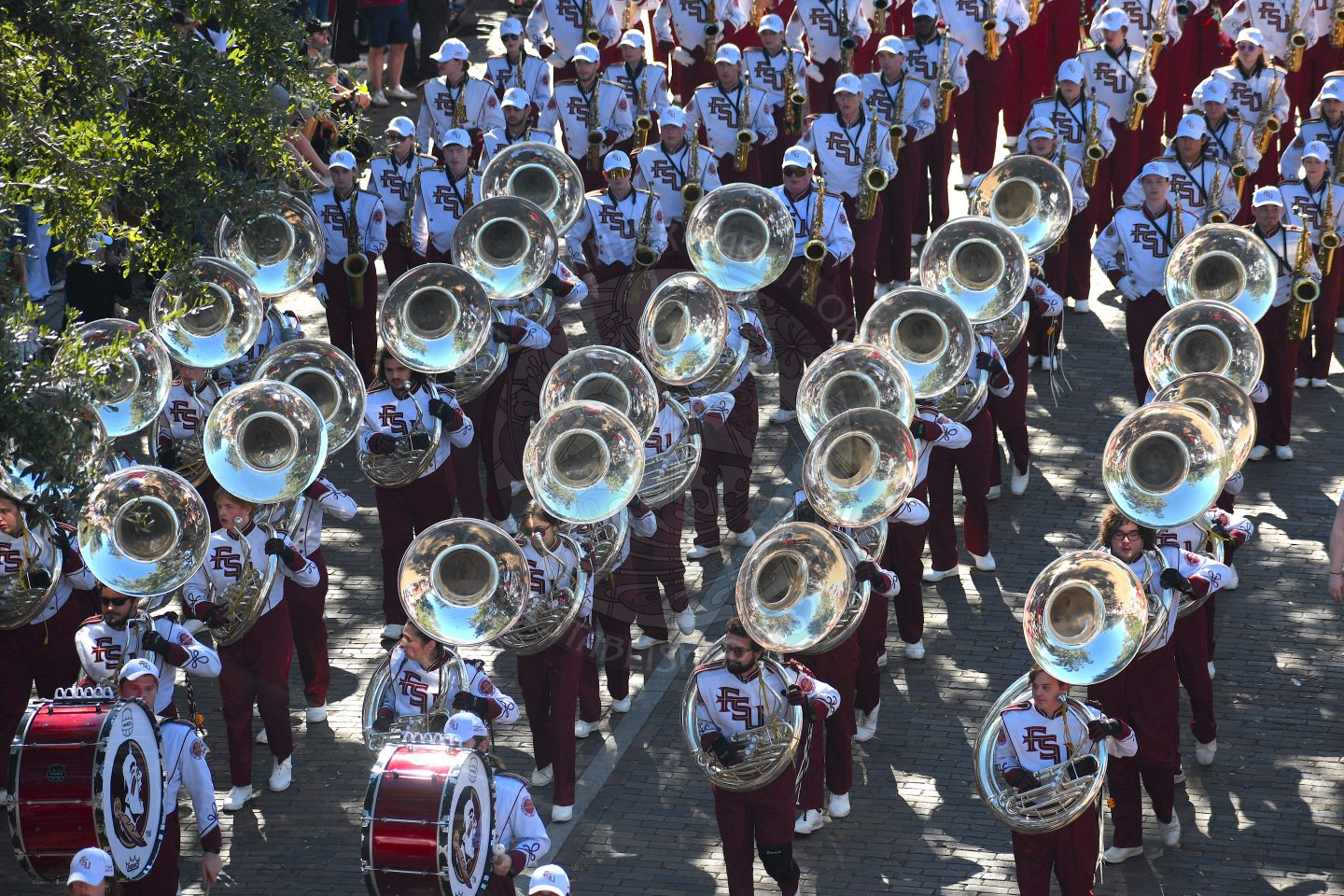 Close up shot of the tubas of FSU band marching down Park Avenue