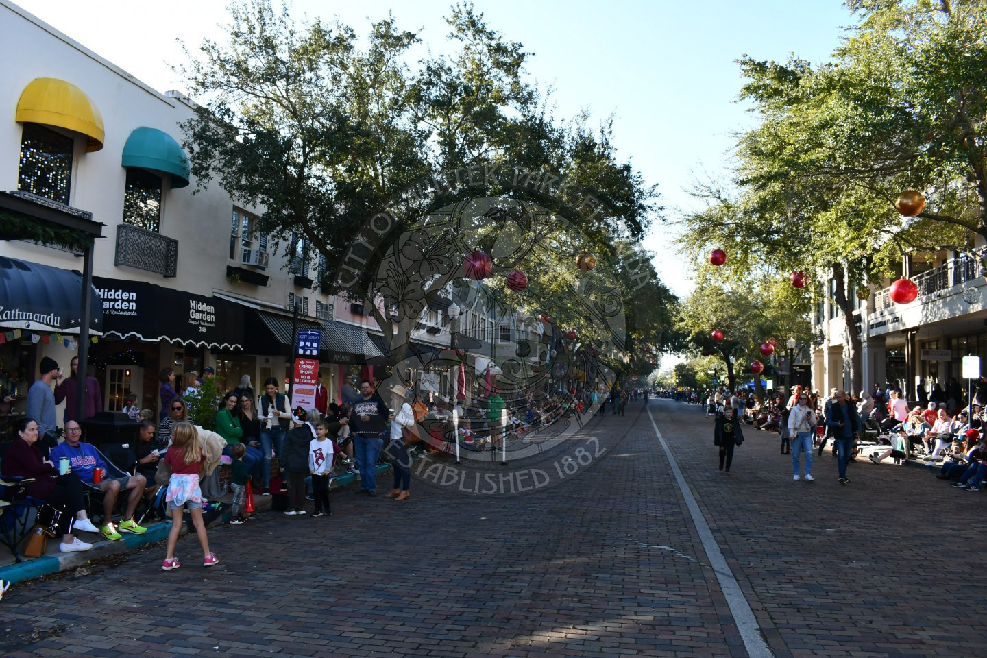 Park Avenue empty with people sitting and standing on the sidewalks waiting for the parade to start