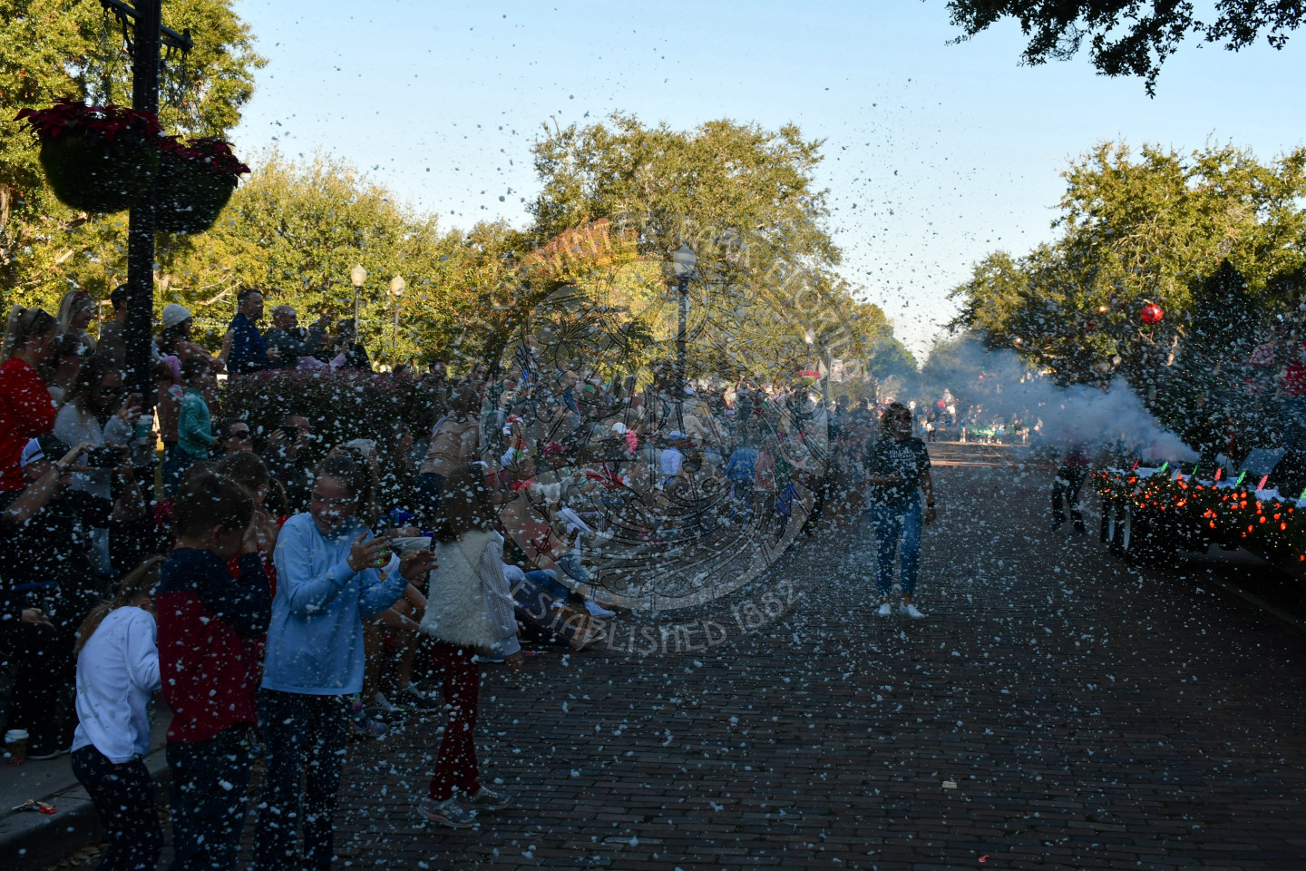 Snow machine blowing fake snow into crowd