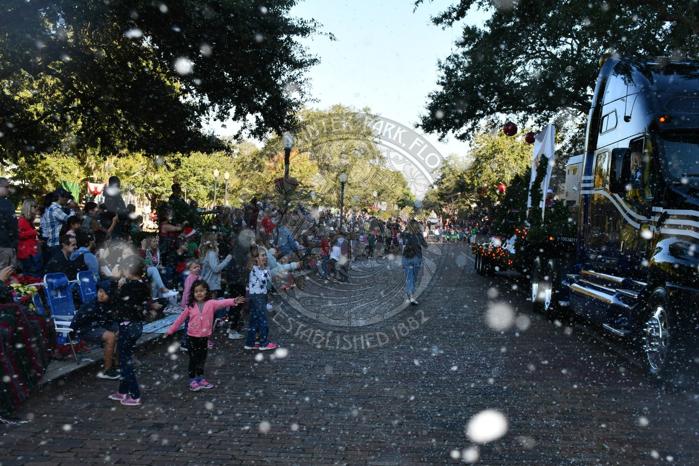 Snow machine blowing fake snow into crowd