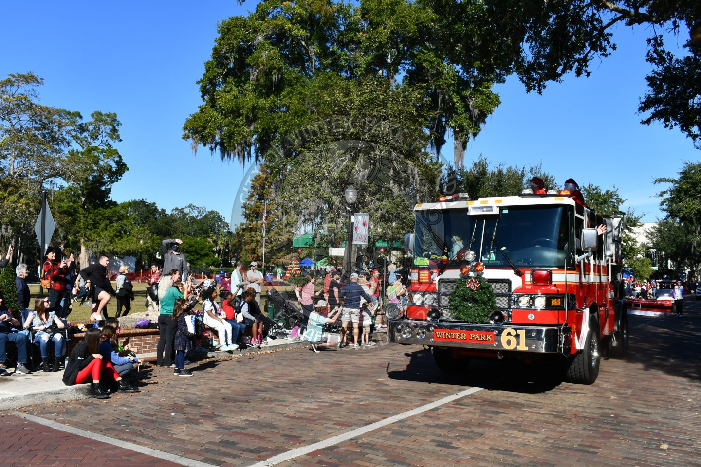 Firefighter driving in the christmas parade route