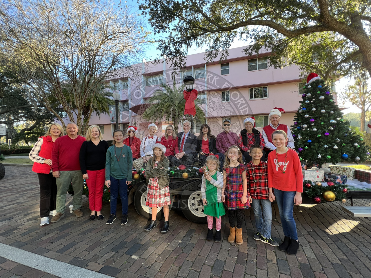 Group photo of the mayor, comissioners, City manager, and assistant city manager with their families