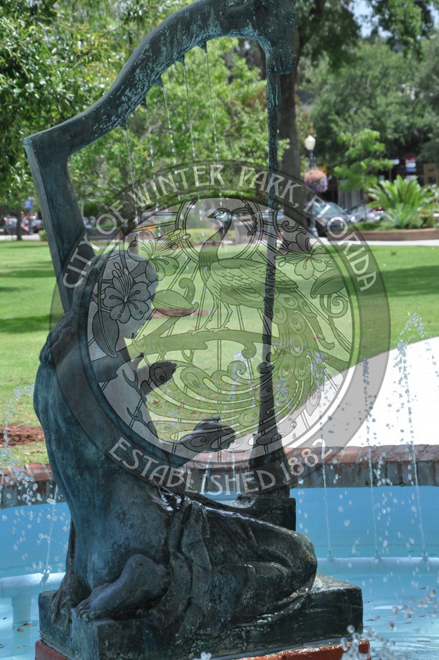 The Emily Fountain - a bronze sculpture of a female playing a harp displayed in the middle of a fountain