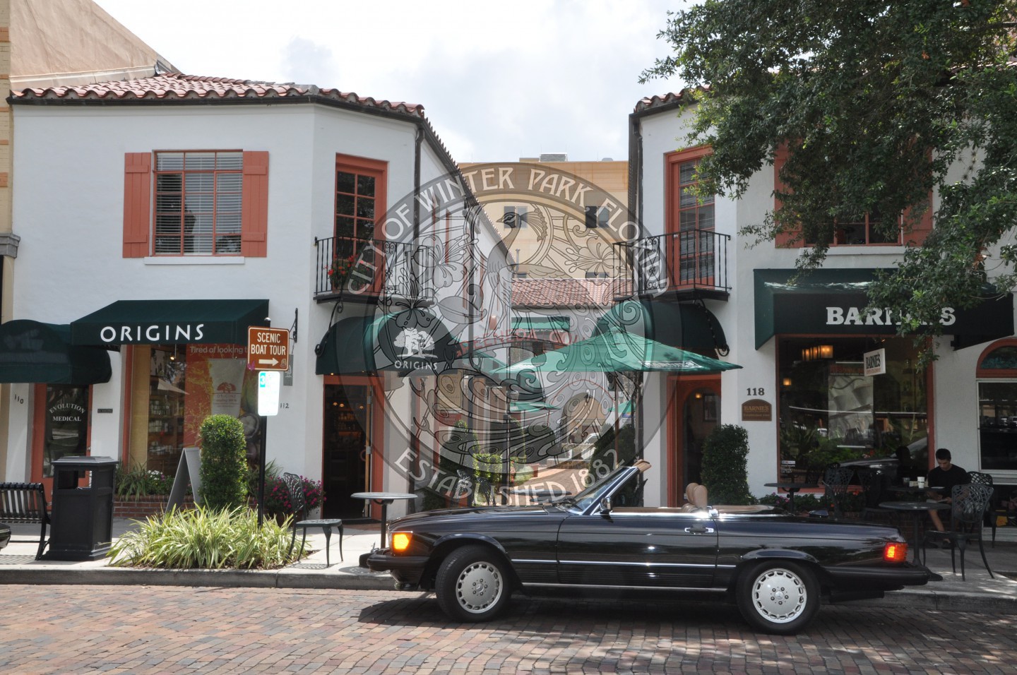View of the Hidden Gardens entry with Barnies Coffee on the right and Origins on the left