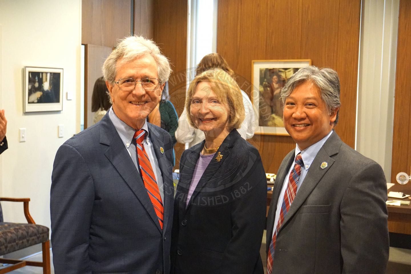Commissioner Sullivan and his wife standing next to Commissioner Cruzada smiling for the camera