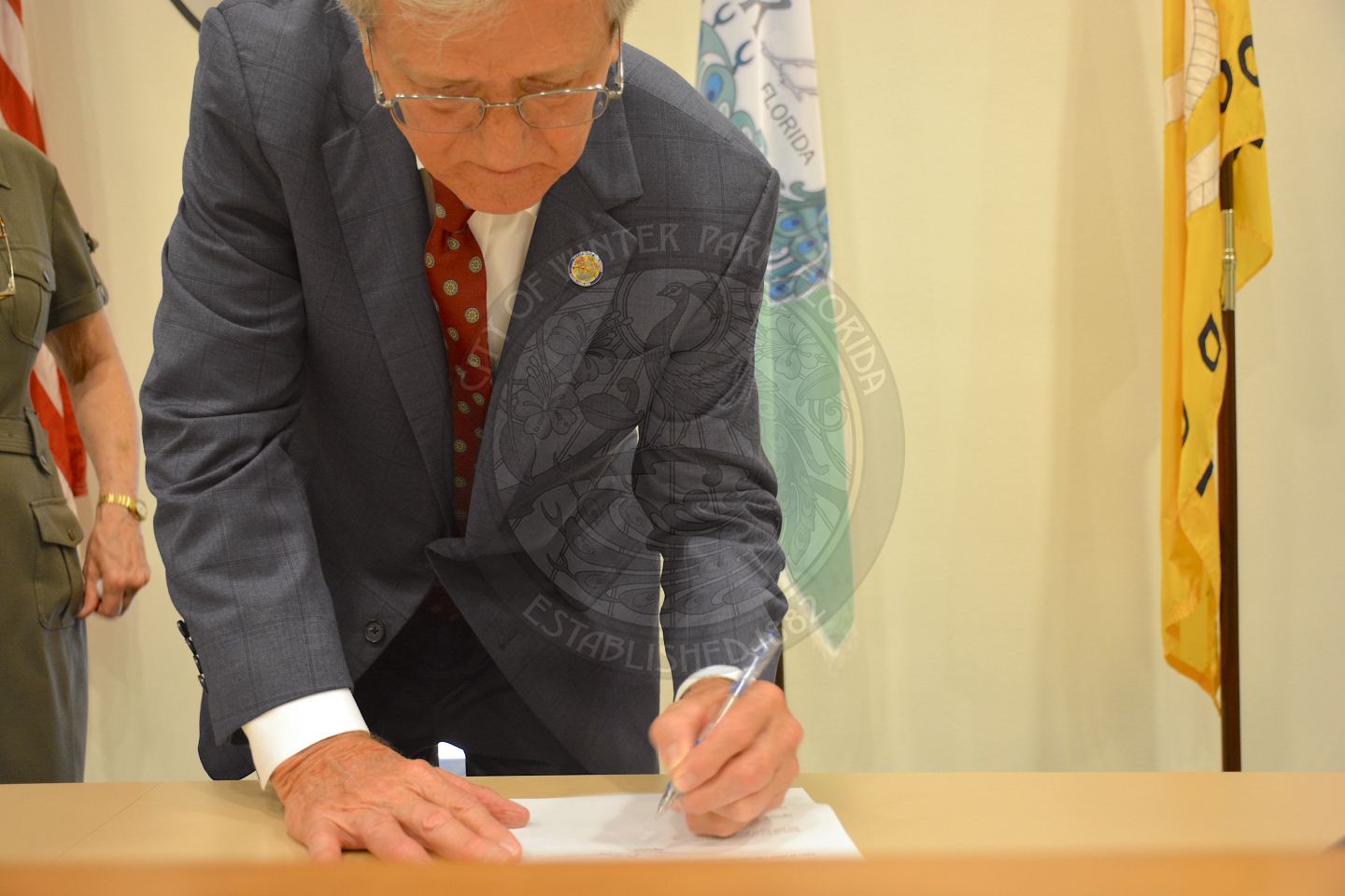Commissioner Sullivan signing the Oath of Office