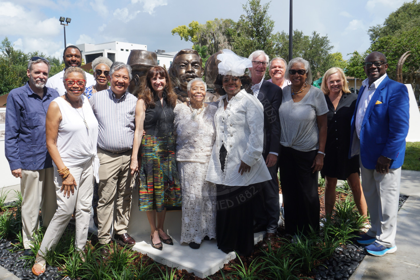 a group photo of a bunch of people smiling.
