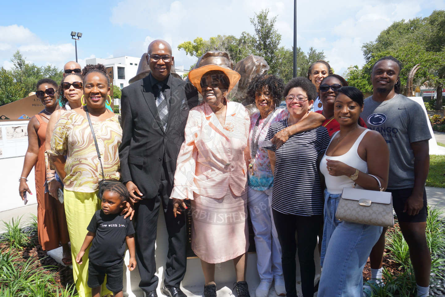 Group photo of the family smiling.