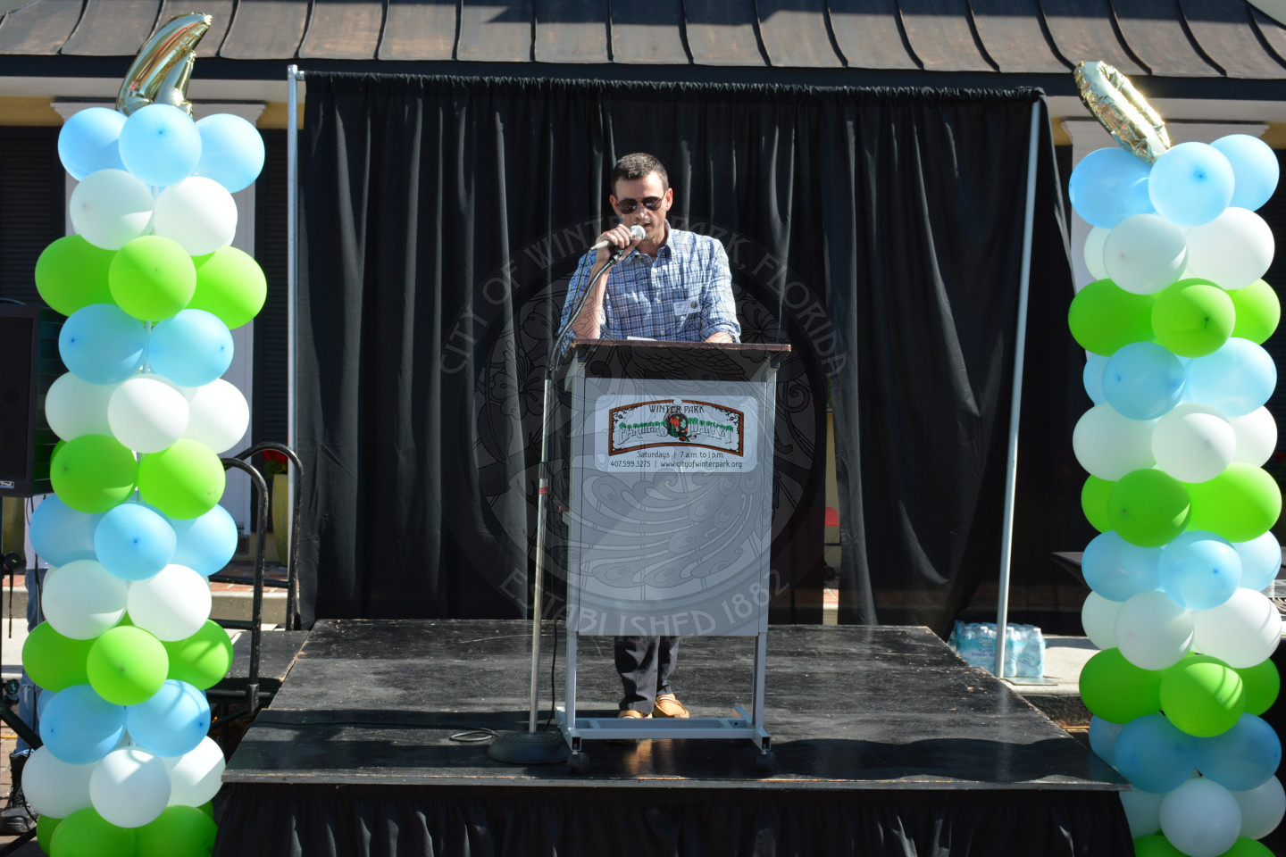 Parks Director sharing remarks at the podium on stage