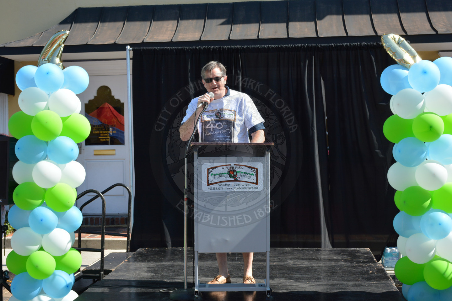 Vice Mayor Greg Seidel welcomes the crowd on the podium on stage