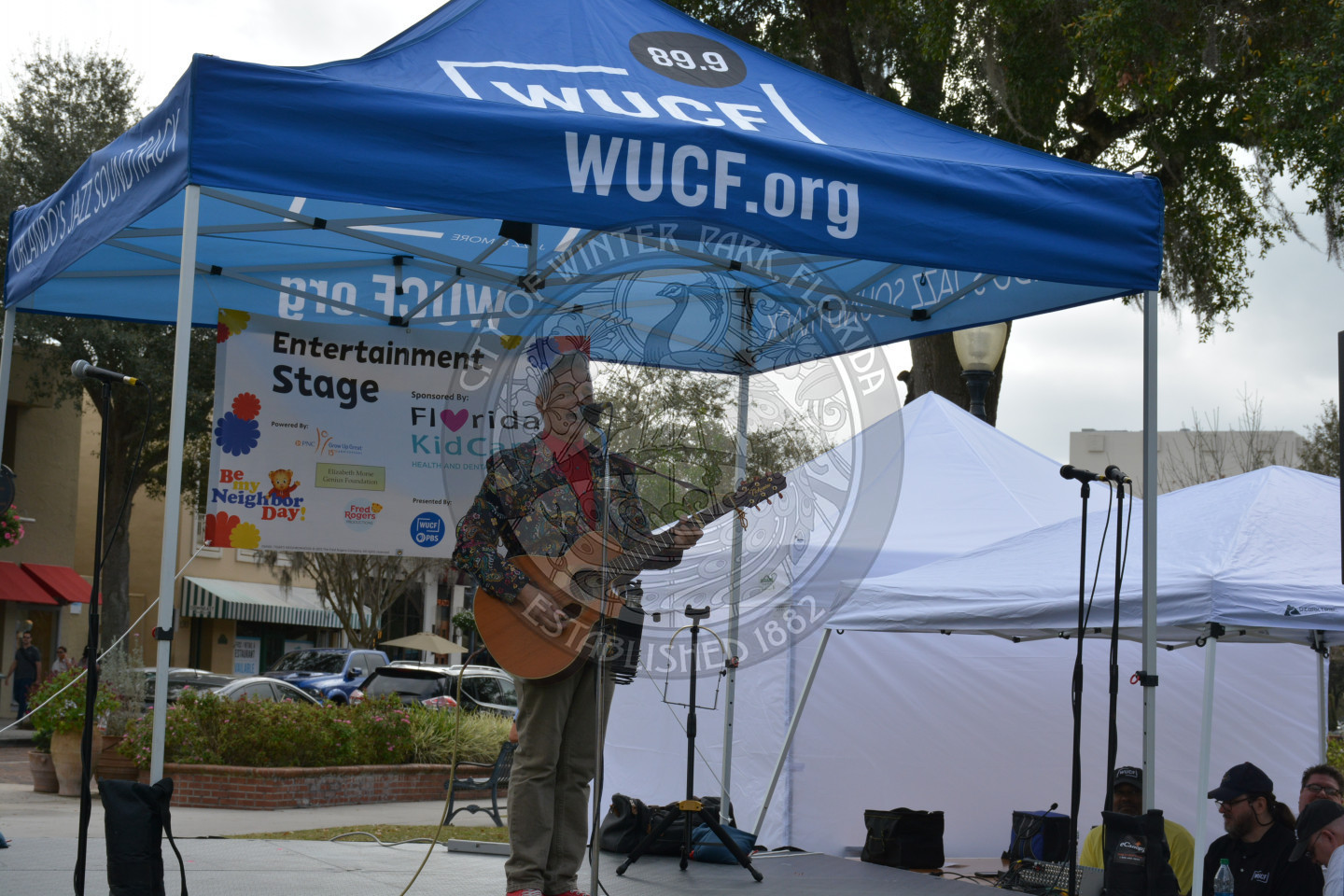 Mr. Richard playing guitar on stage