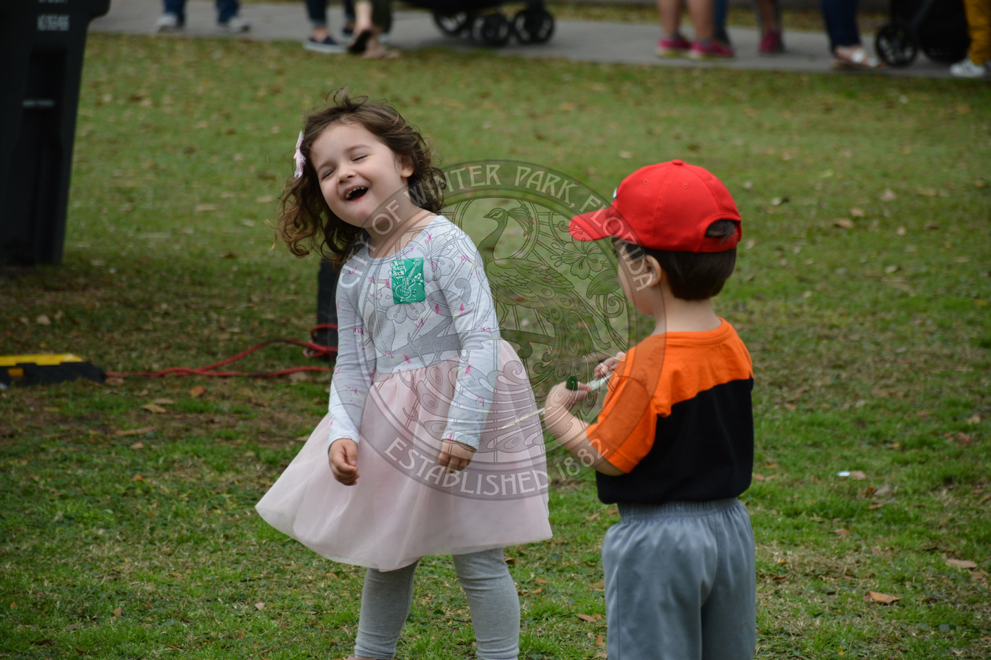 A boy and a girl laughing in Central Park