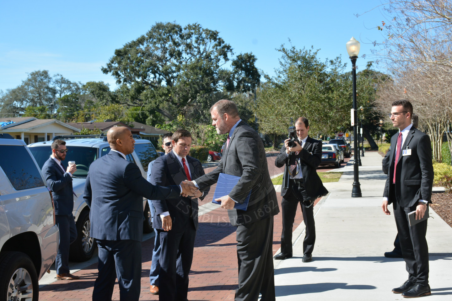 Mayor Steve Leary greeting the staff of Governor Ron DeSantis as they arrive at the Winter Park Community Center