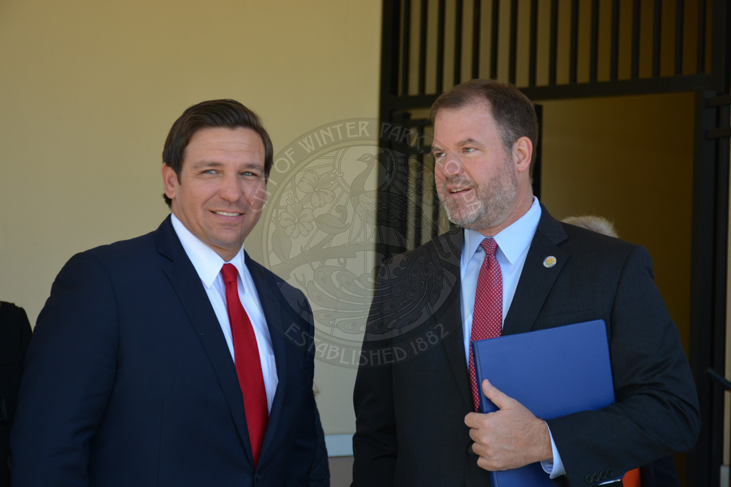 Governor Ron DeSantis and Mayor Steve Leary talking before the event begins