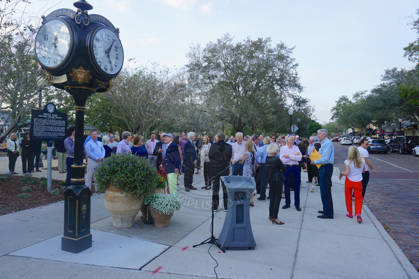Everyone standing waiting for the dedication of the hisotric clock in Central Park.
