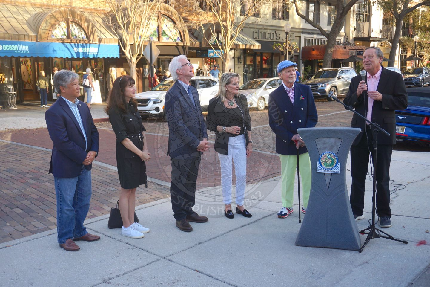 Planning &amp; Zoning director, Jeff Briggs talking in front of podium with 5 people standing next to him.