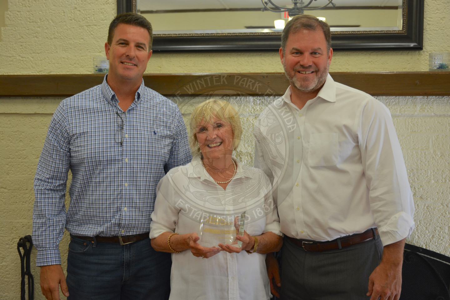 Mayor Steve Leary poses with two award recipients, one male and one female