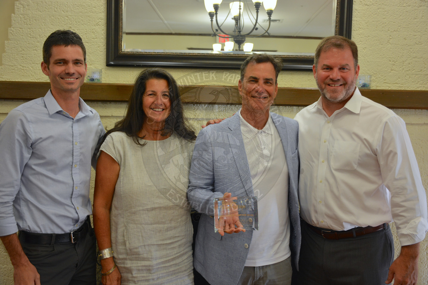 Mayor Steve Leary poses with three award recipients, one female and two males