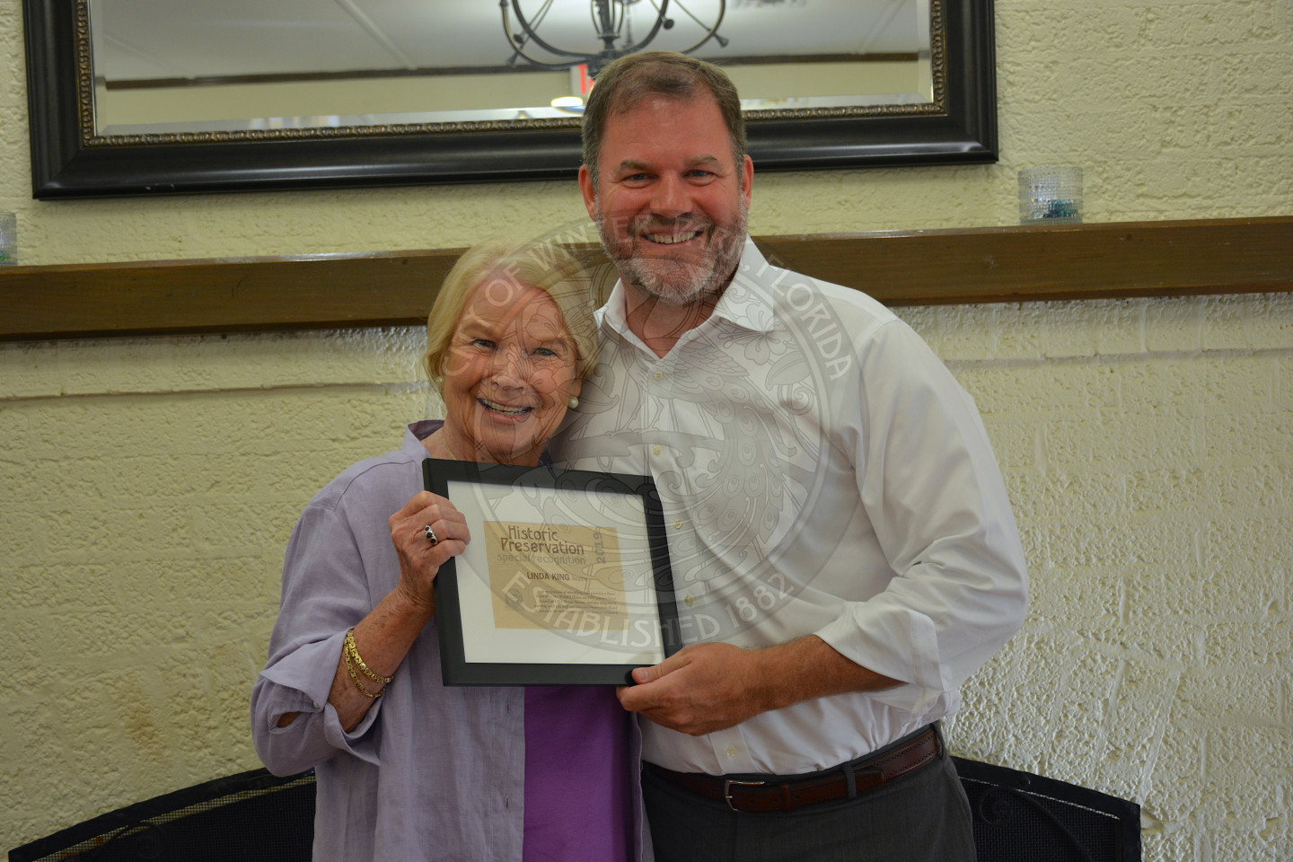 Mayor Steve Leary poses with award recipient, female