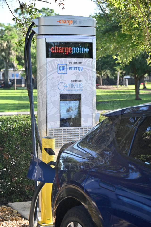 an ev car plugged into a charging station.