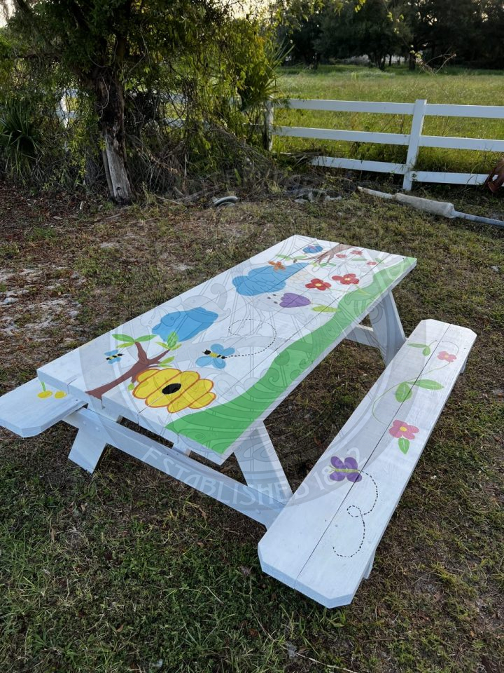 painted picnic table with flowers and butterflies