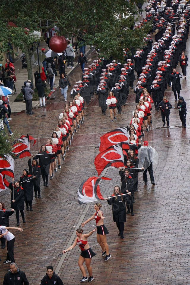 North Carolina State Colorguard and cheerlearders marching down Park Avenue.