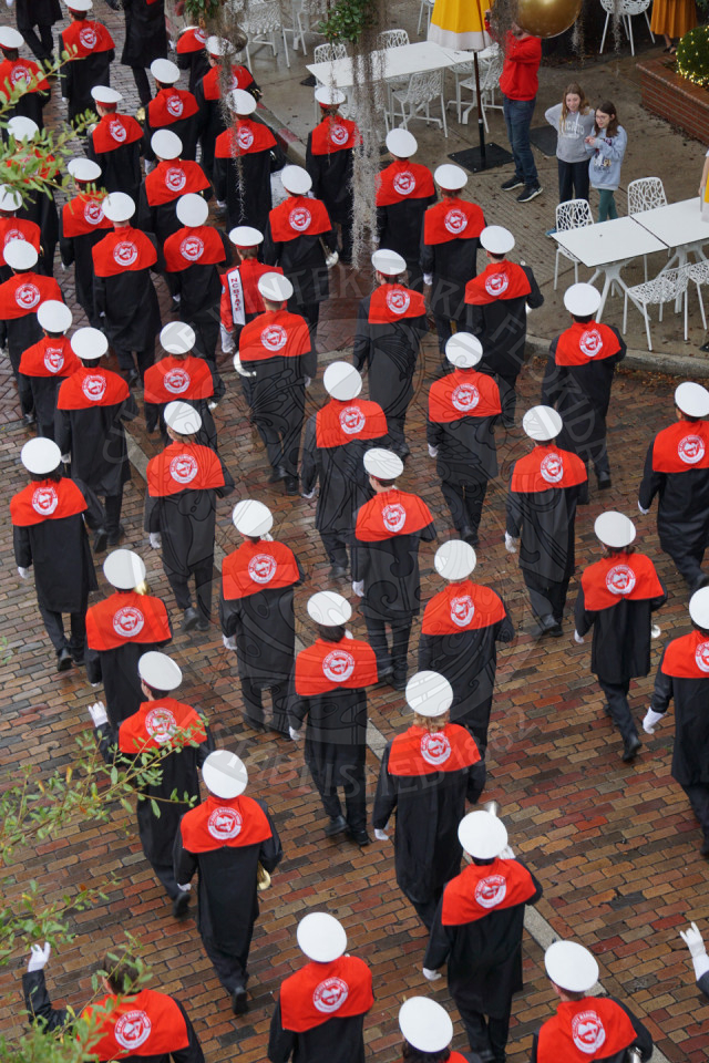 Ariel view of North Carolina State marching down Park Avenue from behind.