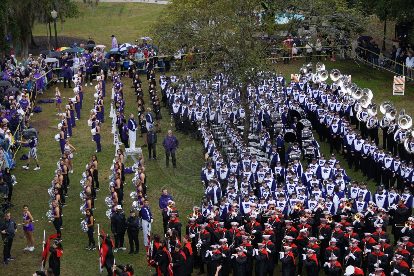 Kansas State band watching North Carolina band perform during their turn of battle of the bands.