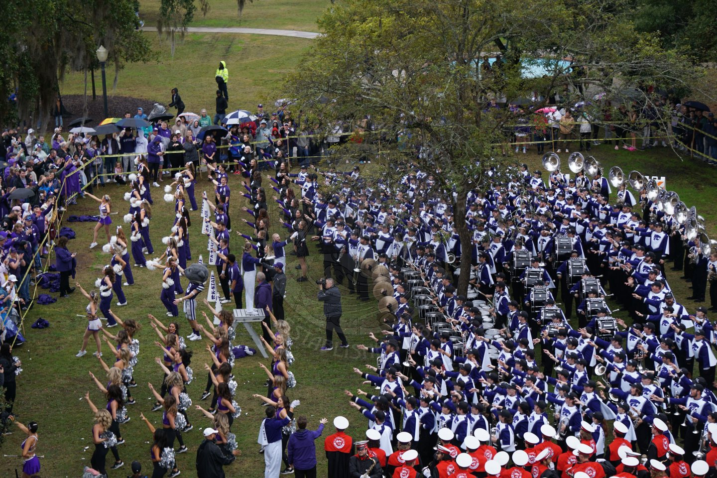 Ariel view of Kansas State band playing their insturments lined up in Central Park.