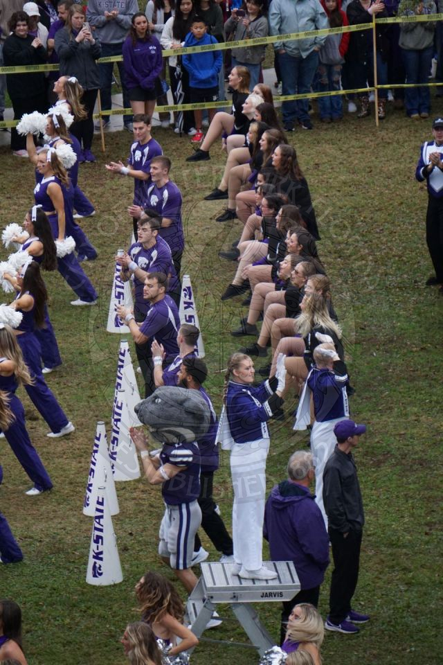Kansas State Drum Major standing on podium directing the band.
