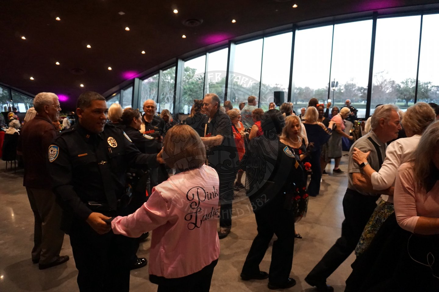 ballroom full of winter park police department officers and seniors dancing the night away.