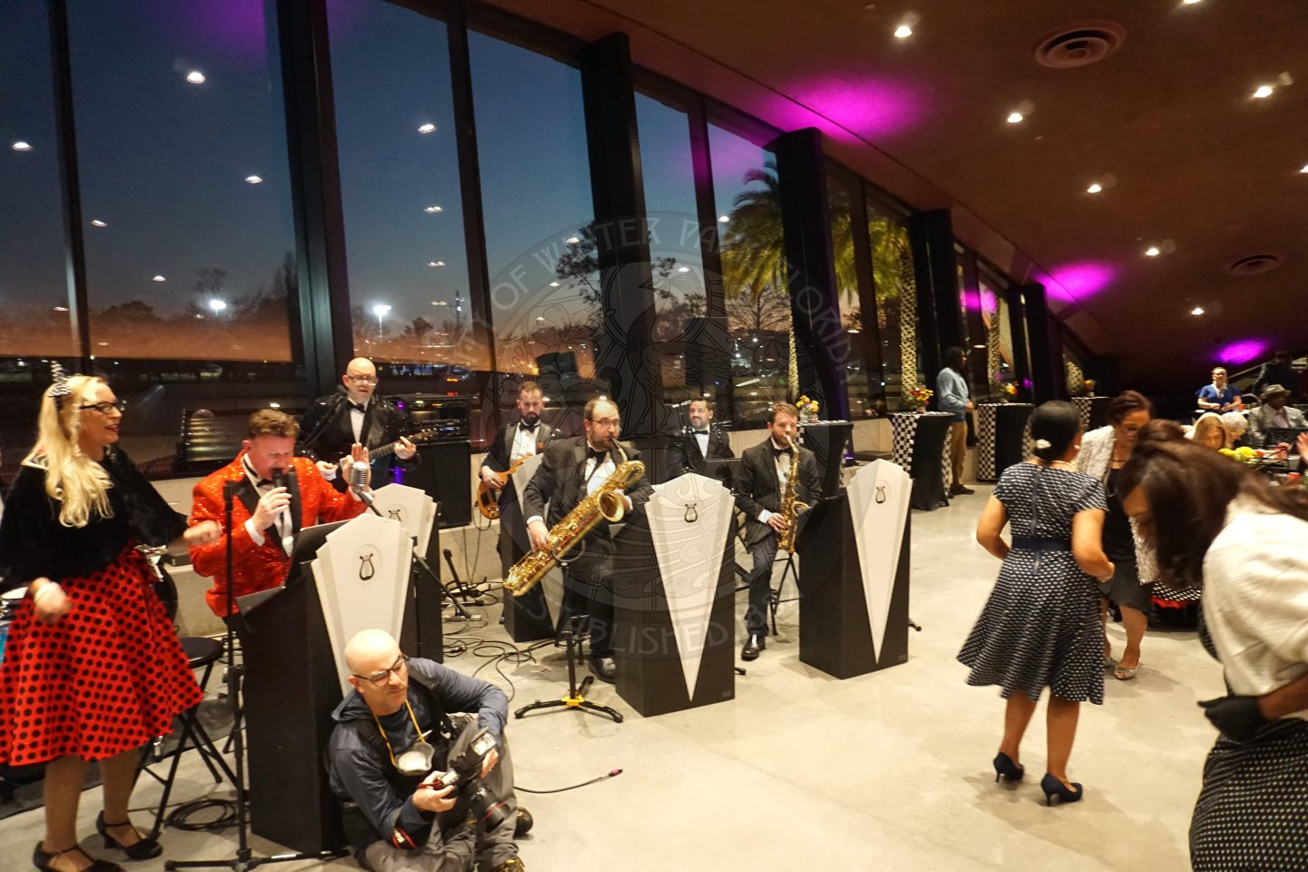 the live band playing insturments for the senior prom.