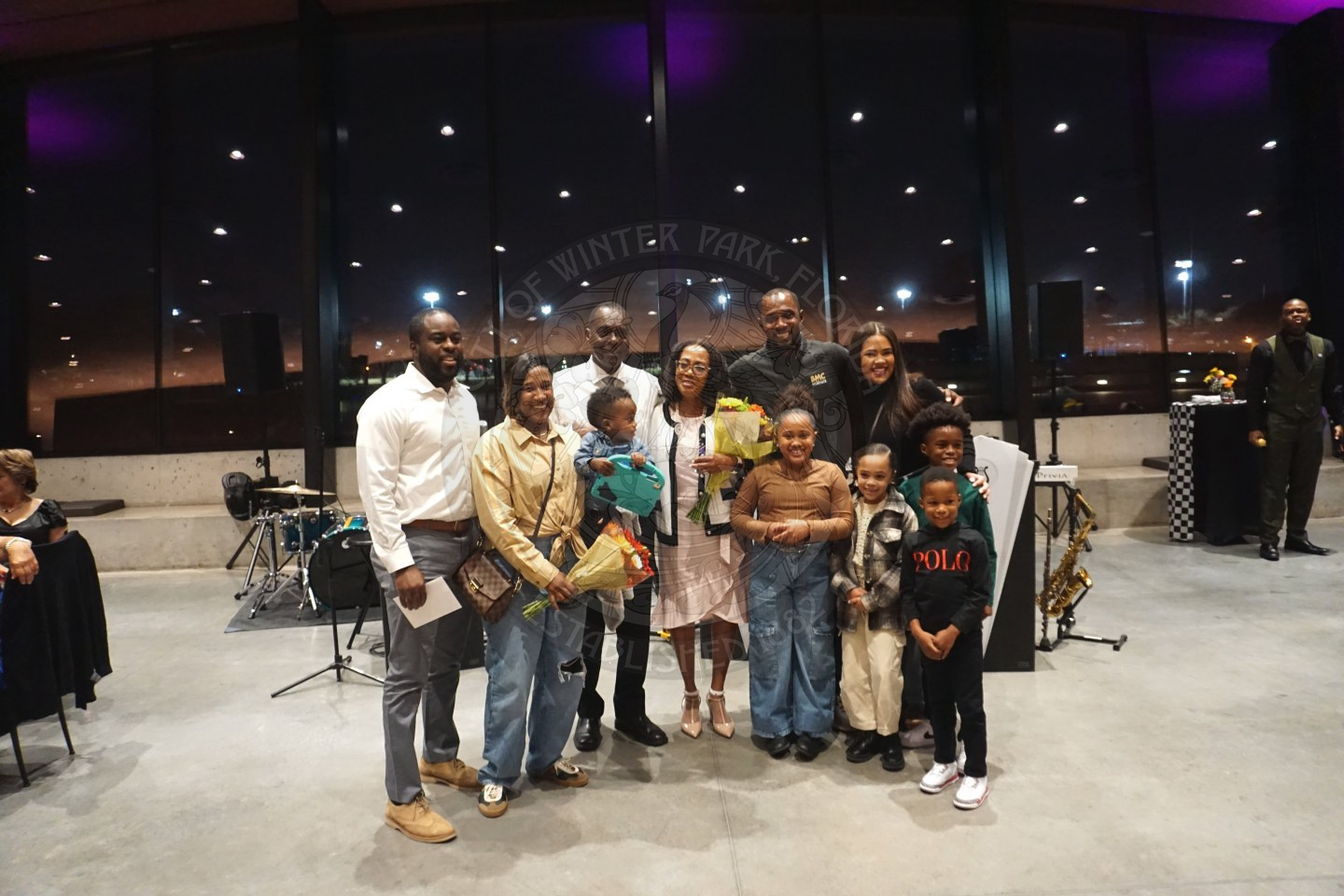 Group photo of the winner of an award and her family. 