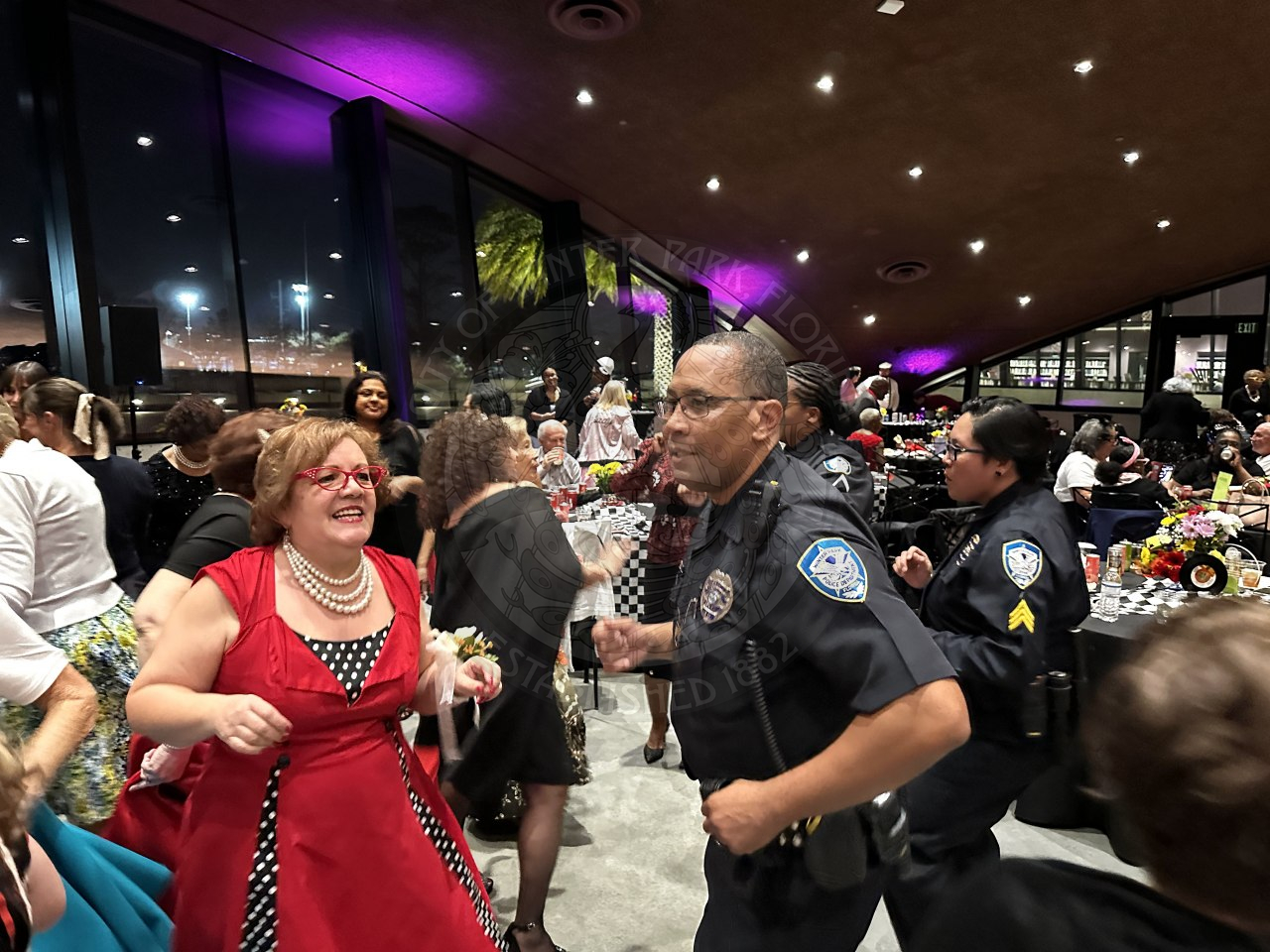 Winter Park Police Department officers on the dance floor dancing with the seniors.