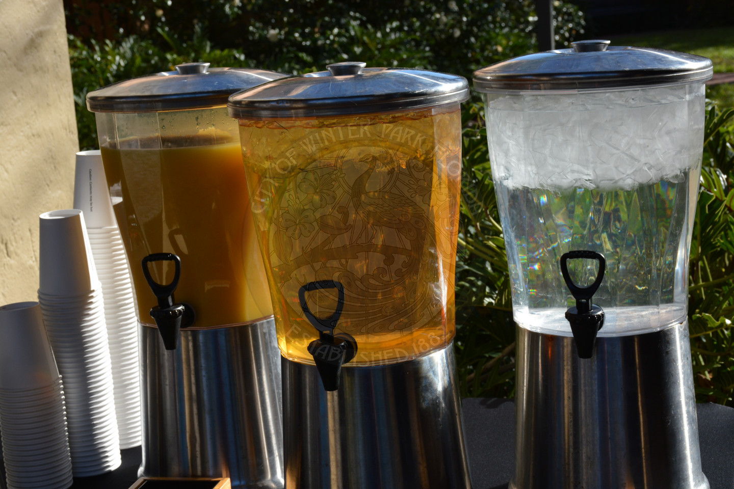 three containers of refreshing morning beverages ready for attendees to enjoy as they cool off.