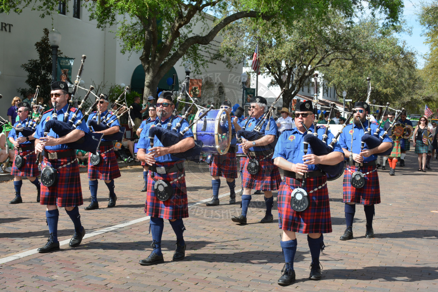 Band playing bag pipes down the parade route