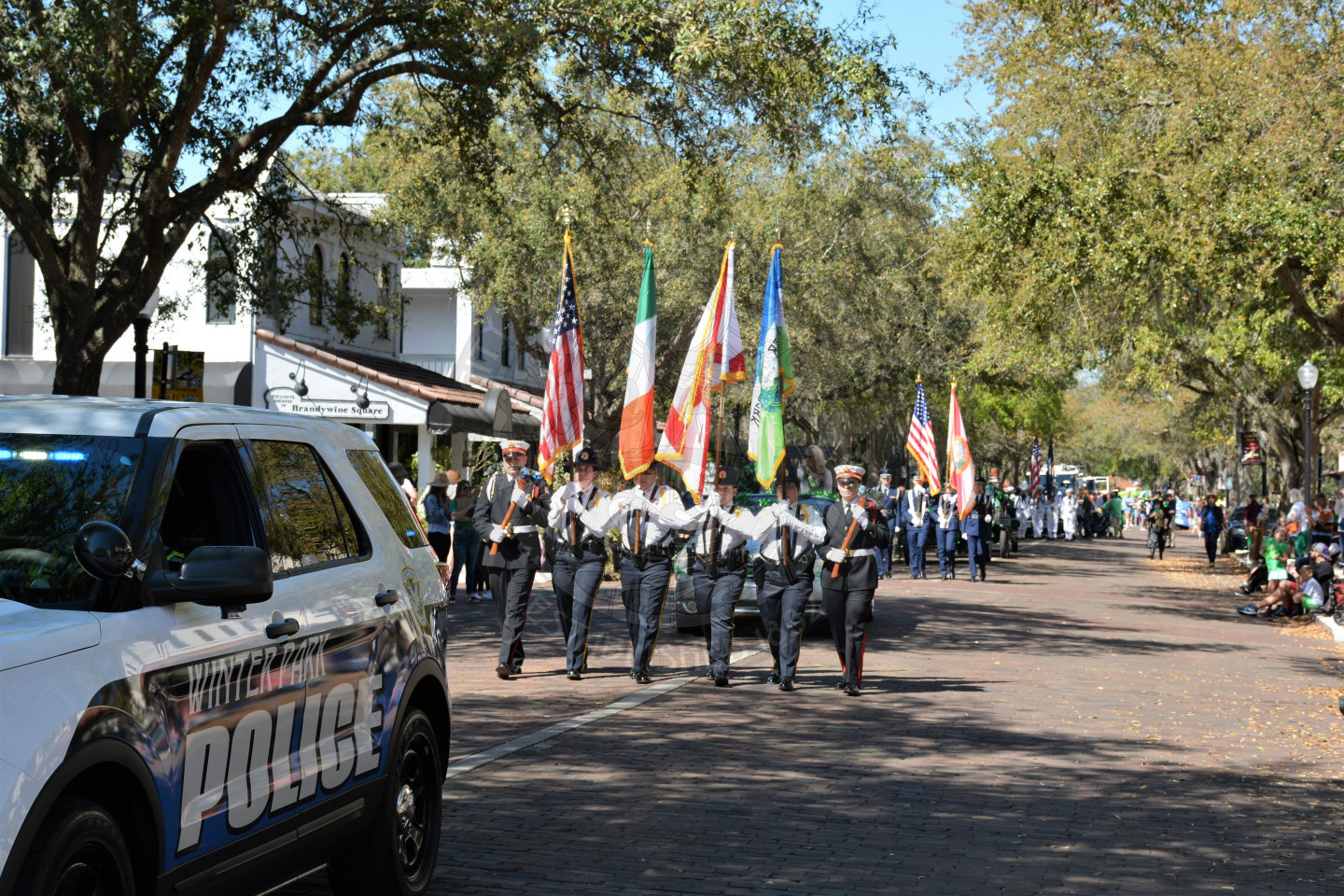 view of the front of the parade with the City of Winter Park honor guard