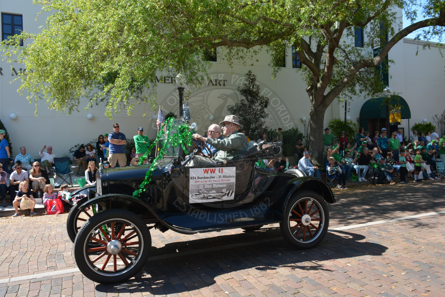 old fashioned car with world war two veteran inside for the parade