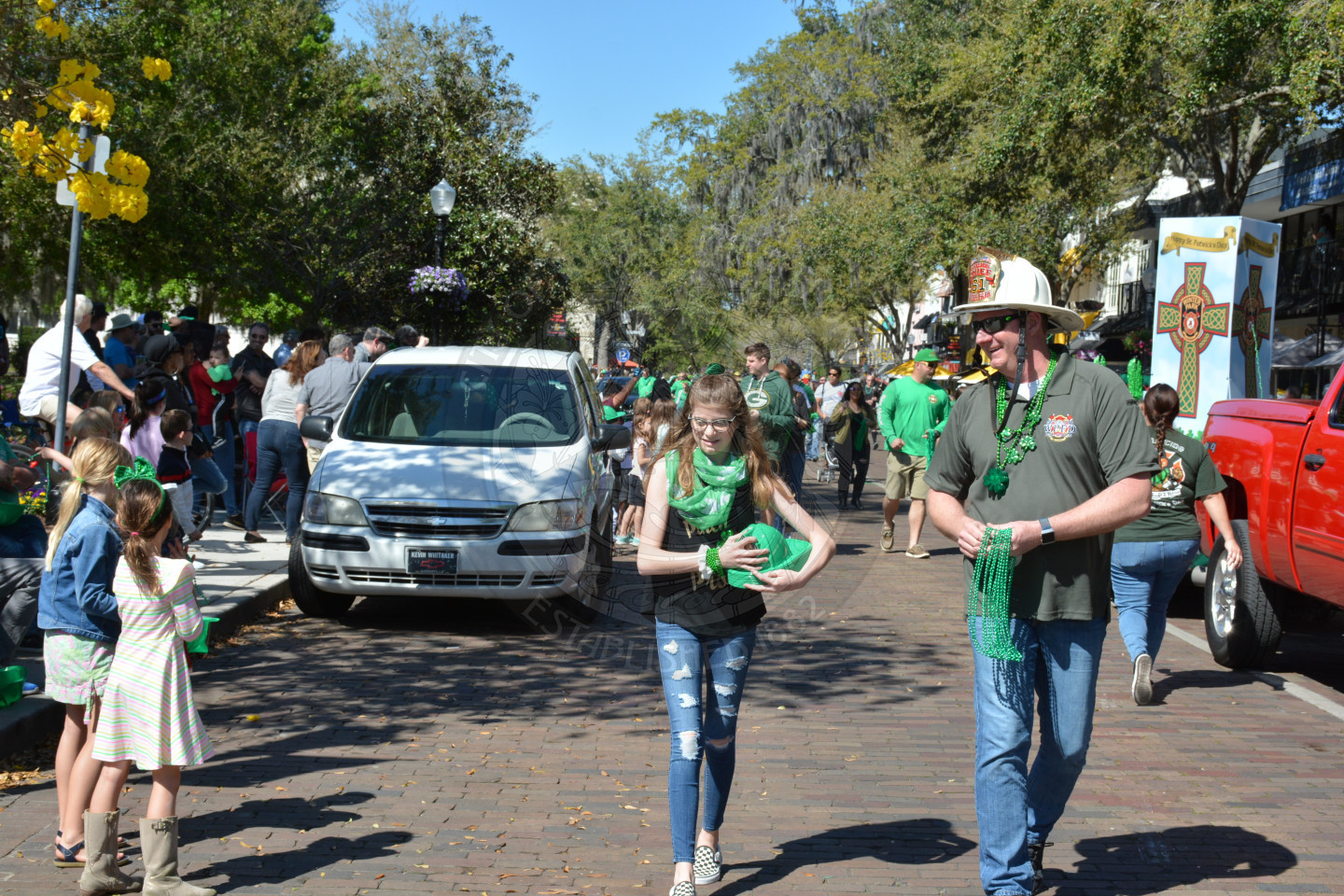 fire chief passing out beads during the parade