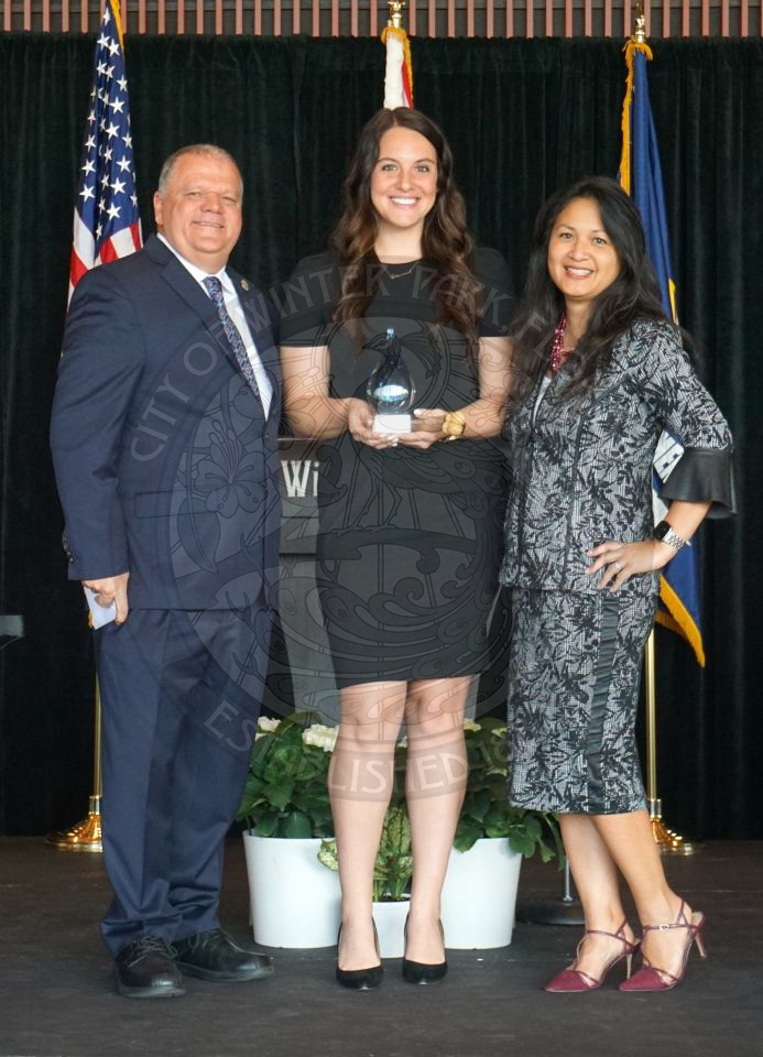 Winter Park Employee of the year posing with the communications director and city manager
