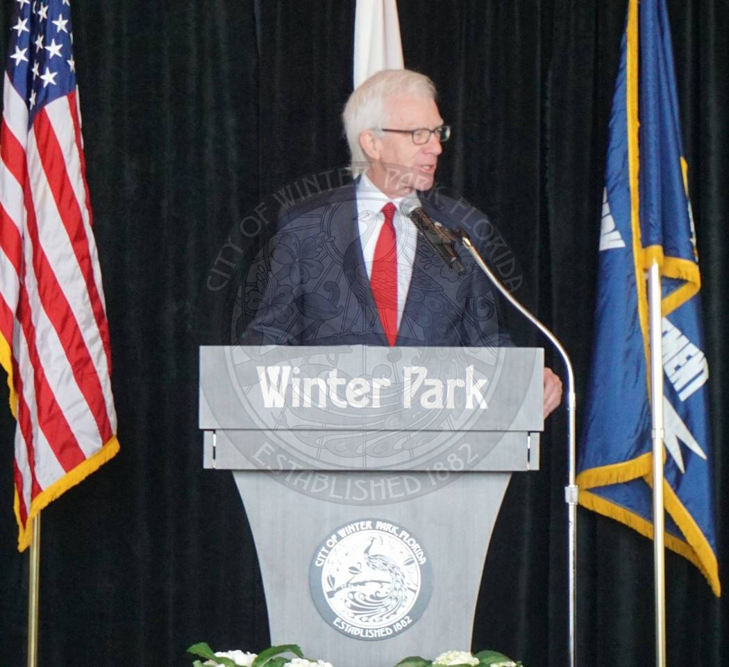 Winter Park Mayor Anderson standing behind podium speaking into the microphone