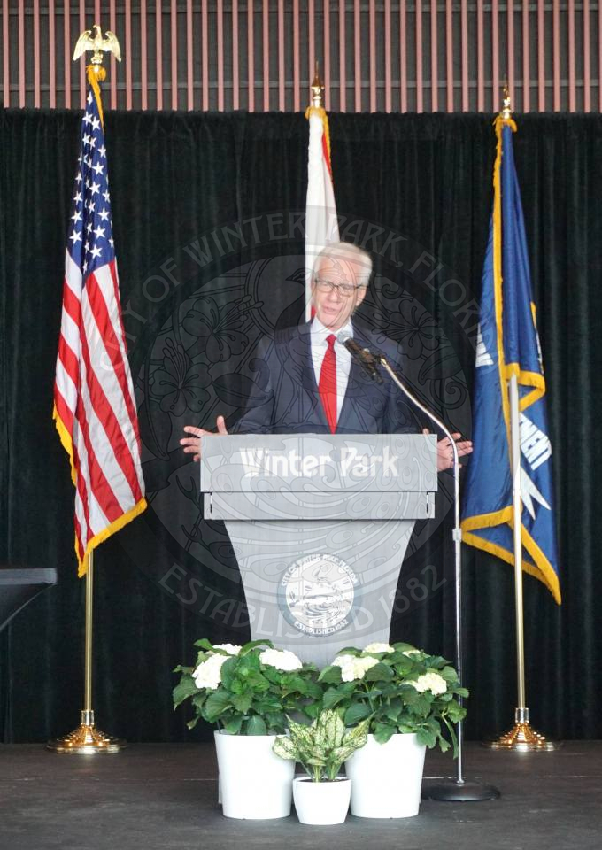 Winter Park Mayor Anderson standing behind podium speaking into the microphone