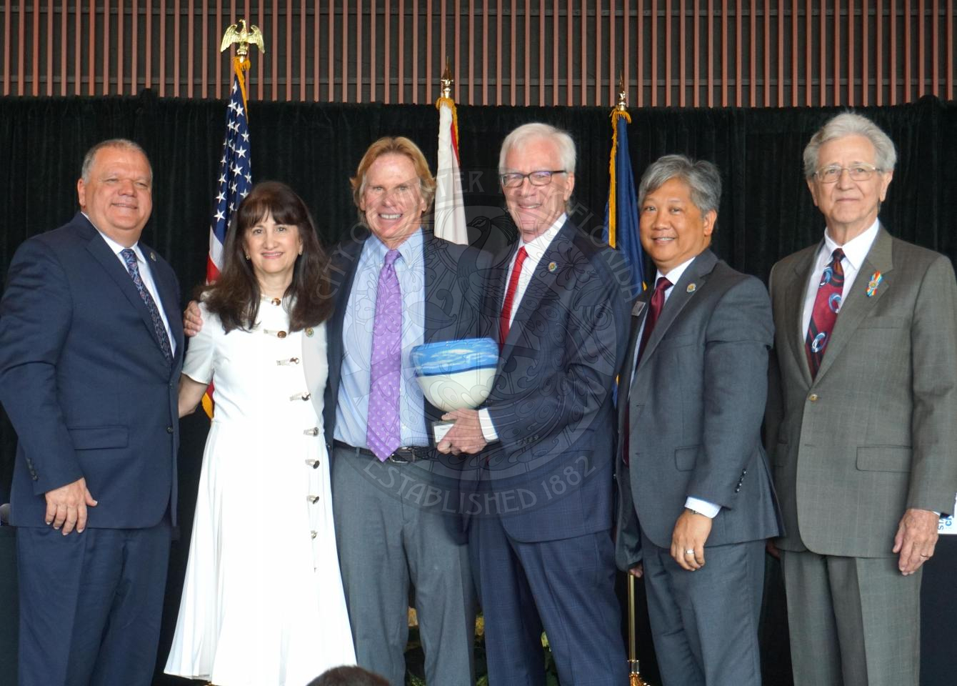 A group shot of the Mayor, Commissioners, City manager, and recipient of mayor's founders award.