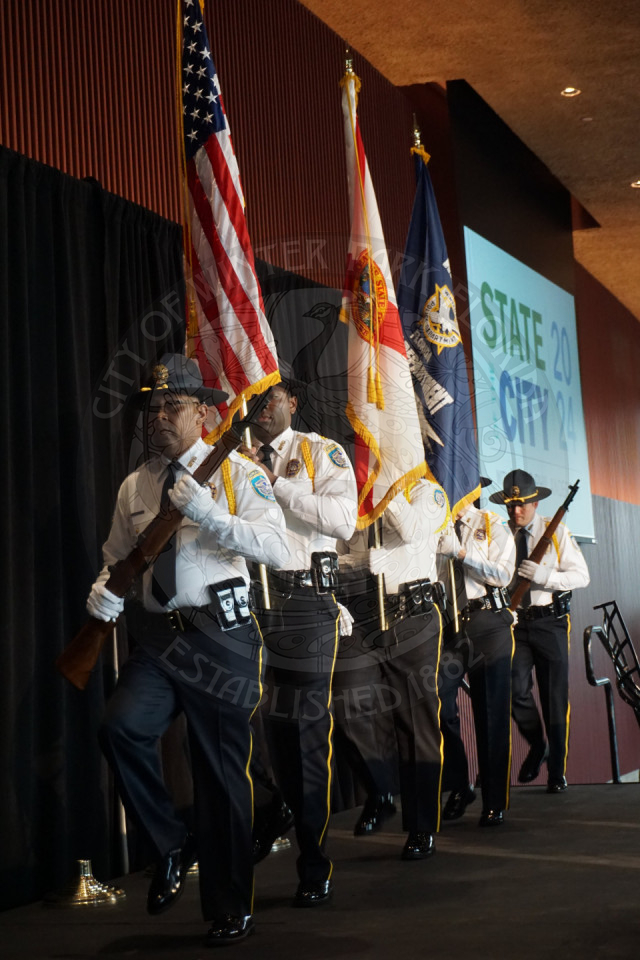 Winter Park Police Dpartment Color Guard  walking onto the stage.