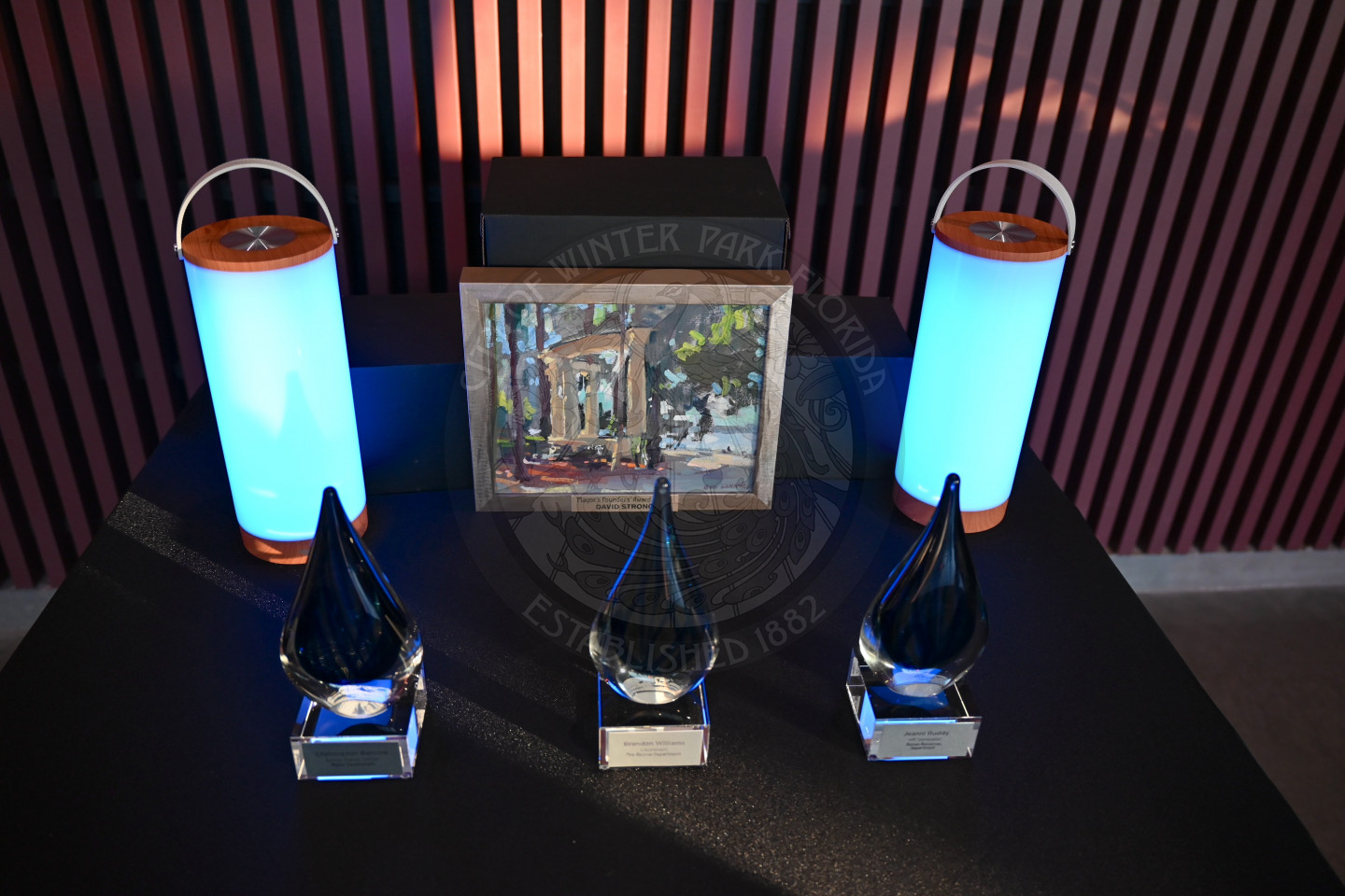 Employee of the Year awards and Mayor Founders' Award with blue lamps next to them